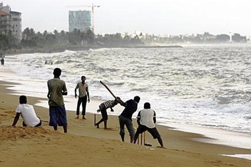 Beach cricket in Colombo - a popular version of Sri Lanka's sporting obsession. Deshakalyan Chowdhury / AFP