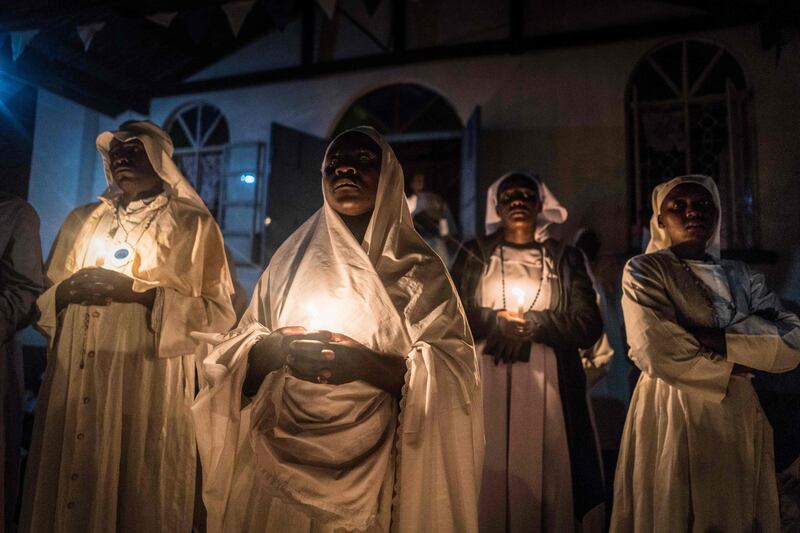 Believers of Legio Maria of African Church Mission hold candles during their overnight Christmas Mass at the church near Ugunja, the western part of Kenya. Fredrik Lerneryd.