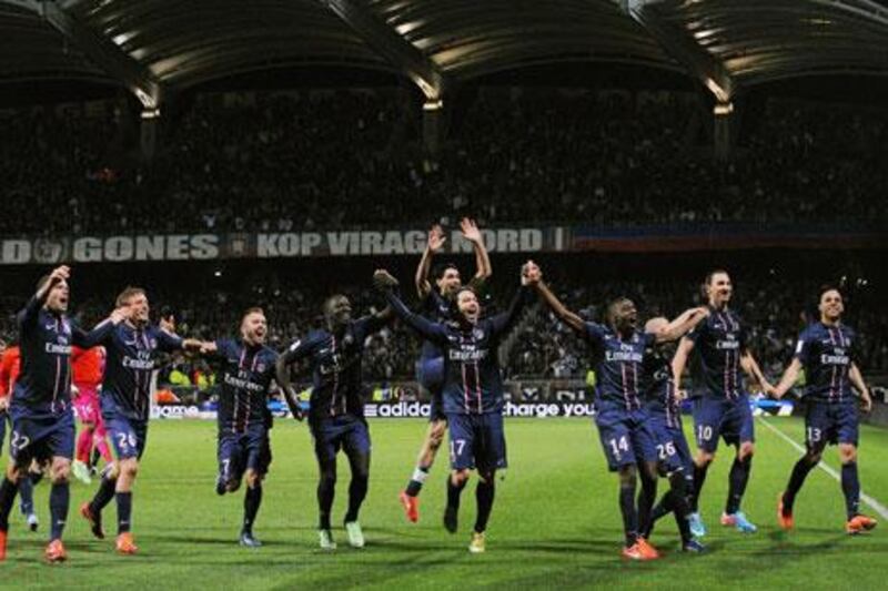 Paris Saint-Germain players celebrate after winning the Ligue 1 title after 19 years. Guillaume Horcajuelo / EPA