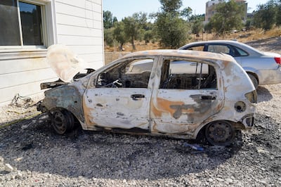 Mujahed Abbadeh's car, outside his family home, was burnt during the Israeli military's raid. Willy Lowry / The National