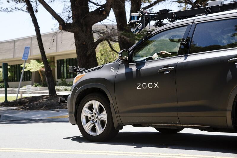 A Zoox Inc. self-driving car is operated outside the company's headquarters in Foster City, California, U.S., on Wednesday May 27, 2020. Amazon.com Inc.’s talks to buy driverless vehicle startup Zoox Inc. has analysts speculating the deal could save the e-commerce giant tens of billions a year and put auto, parcel and ride-hailing companies on their heels. Photographer: Michael Short/Bloomberg