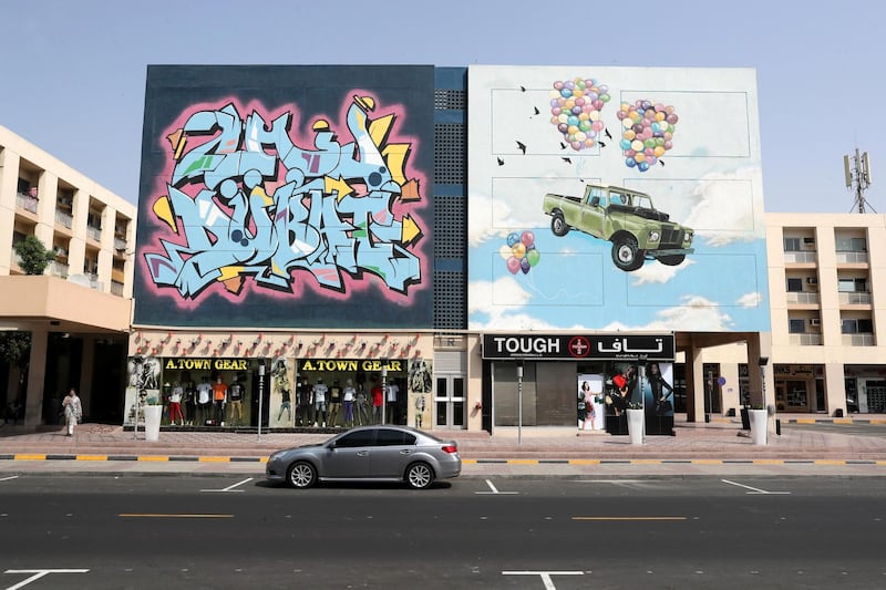 DUBAI , UNITED ARAB EMIRATES, September 20 , 2018 :- Artwork painted by different artists on the wall of Wasl Properties at the Karama shopping complex in Al Karama area in Dubai. ( Pawan Singh / The National )  For Big Picture/Online/Instagram