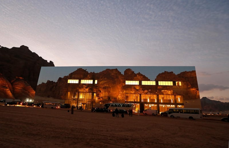 Mountains are reflected on the Mirror Concert Hall, where the 41st Gulf Cooperation Council (GCC) is being held, in Al-Ula, Saudi Arabia, Tuesday, Jan. 5, 2021. Qatar's ruling emir arrived in Saudi Arabia to attend the high-level summit of Arab leaders, following an announcement that the kingdom would end its years-long embargo on the tiny Gulf state. (AP Photo/Amr Nabil)