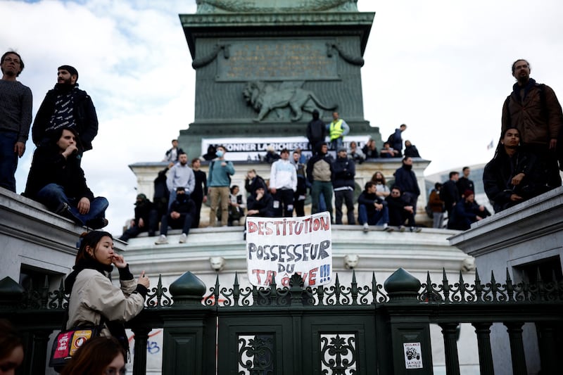 Protesters gather near the July Column on Place de la Bastille. Reuters