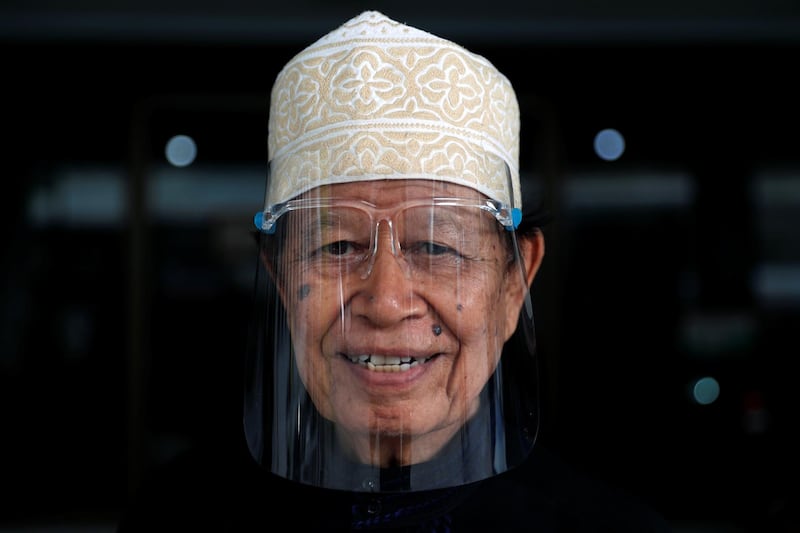 A Muslim man wearing a face shield is seen at a mosque in Bangkok. Reuters