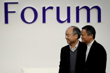 SoftBank Group founder and CEO Masayoshi Son and Alibaba founder and former chairman Jack Ma attend the Tokyo Forum 2019. Mr Ma is leaving the board of the Japanese group. Reuters