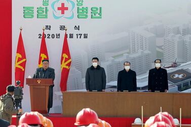 In this March 17 photo provided by the North Korean government, leader Kim Jong Un, left, delivers a speech during the ceremony of a general hospital in Pyongyang, North Korea. North Korea says it has zero coronavirus infections, but experts say it’s likely the virus has already spread in the country. Korean Central News Agency/AP