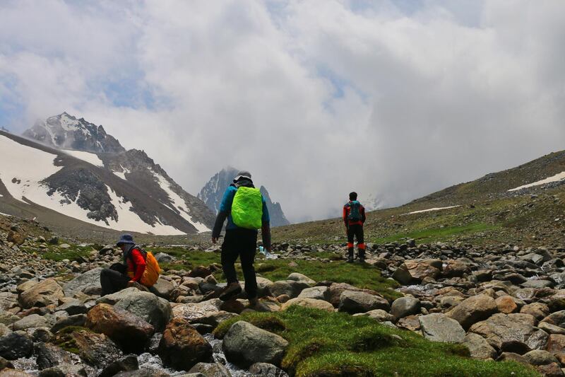 Zabih Afzali pictured on the right, with friends, on the expedition up Mount Shah Fuladi, June 2020. Courtesy Zabih Afzali