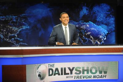 Trevor Noah behind the 'The Daily Show' desk. Getty Images
