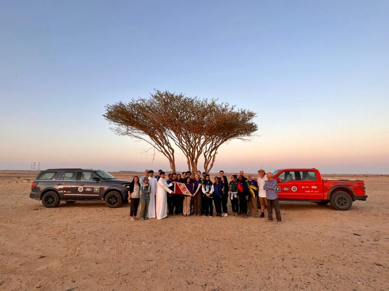 The expedition team with locals in the Saudi desert on their trip