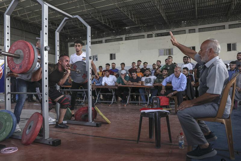 A Palestinian takes part in a weightlifting championship in the southern Gaza Strip town of Khan Yunis. 