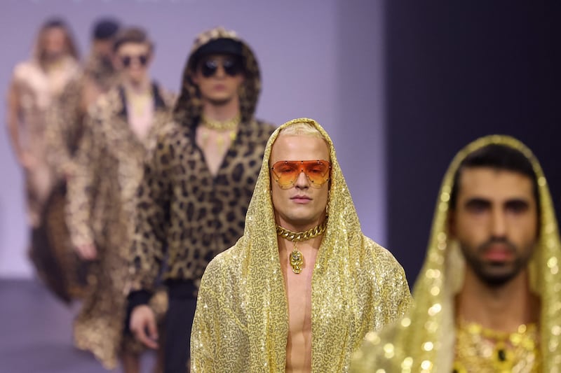 The black runways had male and female models saunter down, decked out in intricate ensembles in every shade of gold.