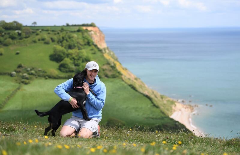 Dom Bess pictured with his family dog Tilly in Shipton. Getty