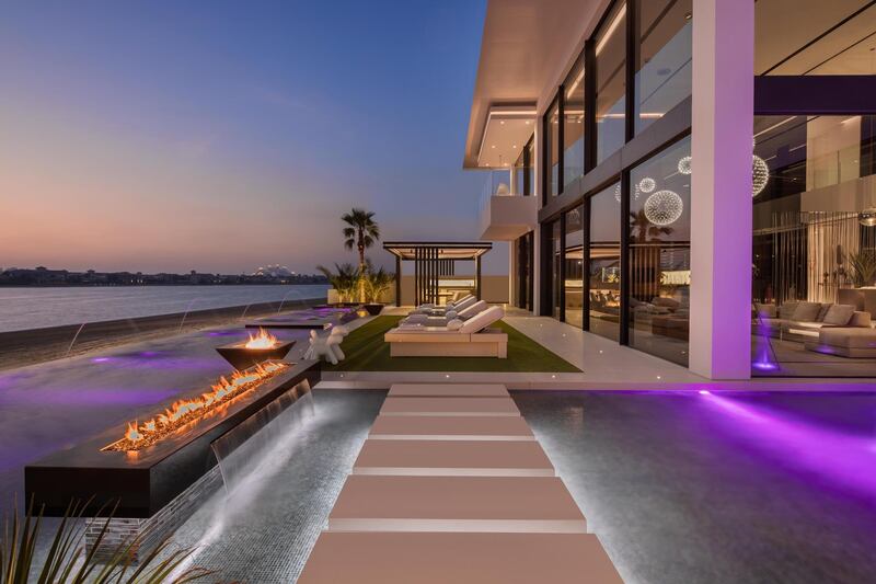 Outside of the property at dusk. Courtesy Luxhabitat Sotheby's International Realty