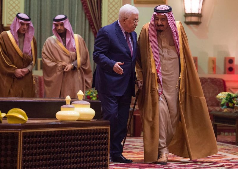 In this photo released by Al-Ekhbariya, Saudi King Salman, right, receives Palestinian President Mahmoud Abbas after he arrives in Riyadh, Saudi Arabia, Wednesday, Dec. 20, 2017. (Al-Ekhbariya via AP)