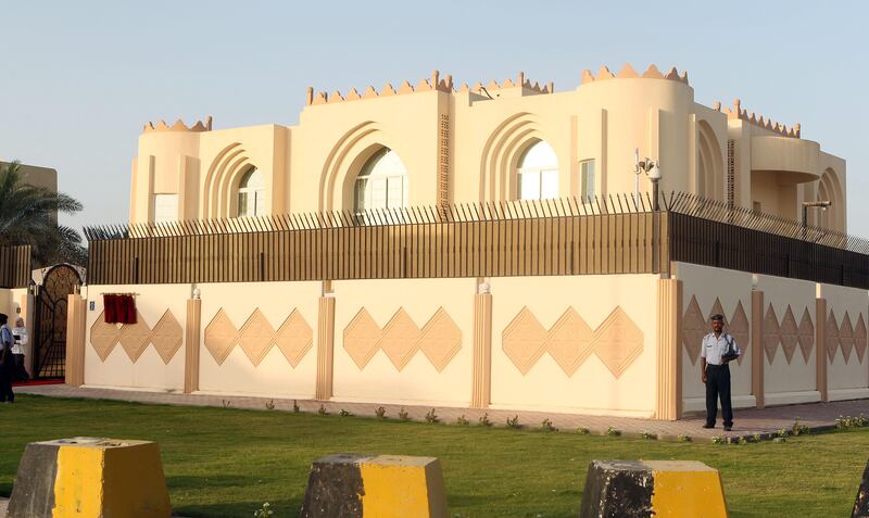 Security guards stand outside the new Taliban political office in Doha before the official opening on June 18, 2013. The office is intended to open dialogue with the international community and Afghan groups for a "peaceful solution" in Afghanistan, office spokesman Mohammed Naim told reporters. AFP PHOTO / FAISAL AL-TIMIMI / AFP PHOTO / FAISAL AL-TAMIMI