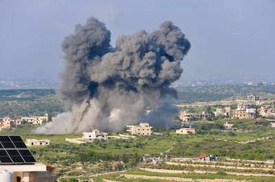 Smoke billows from the site of an Israeli air strike on the southern Lebanese village of Majdal Zoun on Monday. AFP