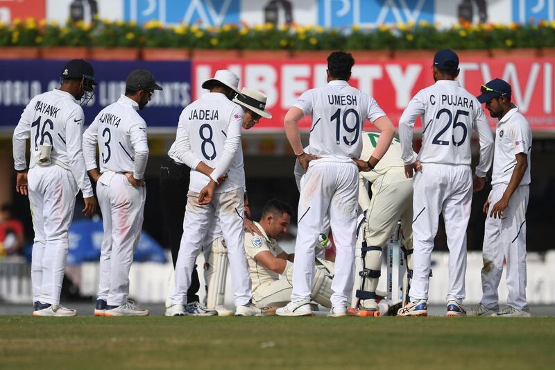 South Africa's Dean Elgar after being hit by a ball. AFP