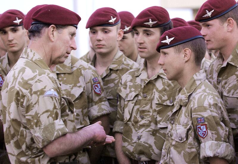 The prince speaks with members of the Royal Regiment of Wales and the Parachute Regiment in Basrah, Iraq in 2004