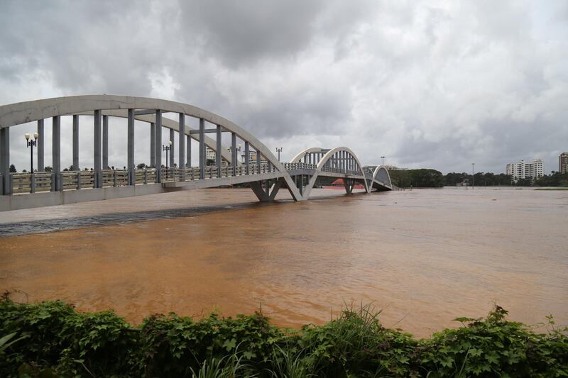 Water flows under a bridge following heavy rain.  EPA