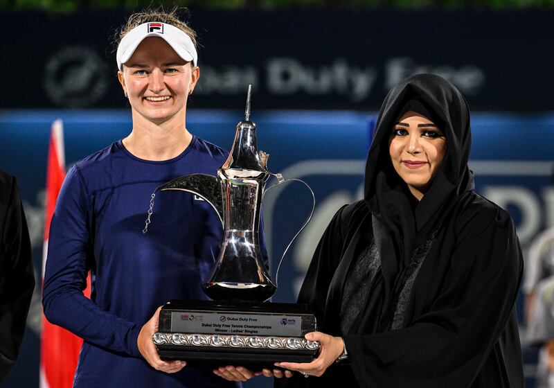 Barbora Krejcikova receives her trophy from Sheikha Latifa bint Mohammed in Dubai. EPA
