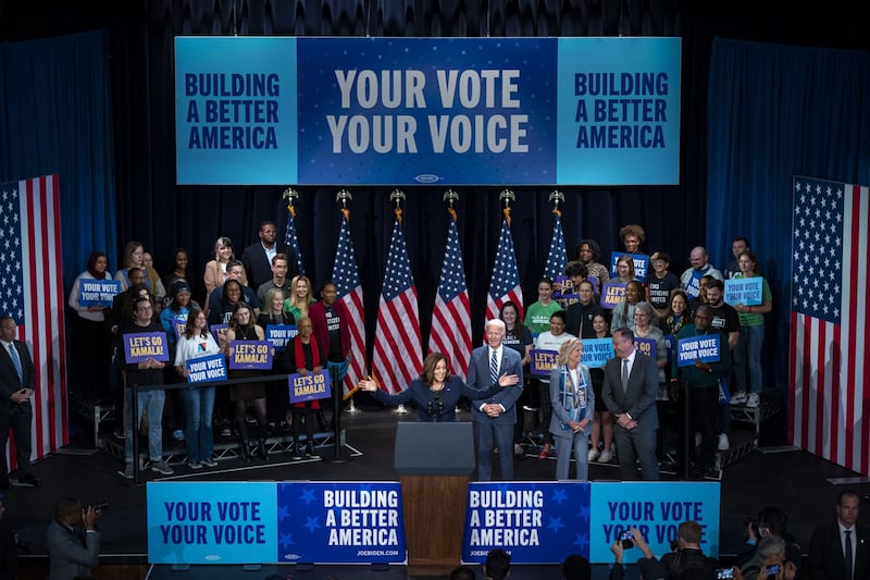 US Vice President Kamala Harris speaks at a Democrat rally in Washington, as President Joe Biden and their spouses Jill Biden and Doug Emhoff listen. Bloomberg