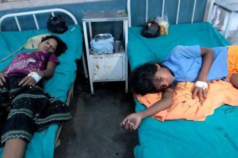 Indian school girls receive treatment after suffering from suspected food poisoning in Patna, India.