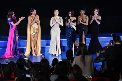 From left: Miss Universe 2018 Catriona Gray, Miss Universe 2020 Andrea Meza, chief executive of JKN Global Group Anne Jakrajutatip, Miss Universe 2021 Harnaaz Sandhu, Miss Universe 2011 Leila Lopes and Miss Universe 2005 Natalie Glebova. AFP