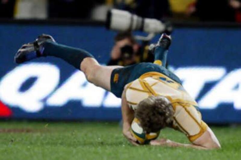 The Australian centre Peter Hynes scores a try against the New Zealand All Blacks during their Bledisloe Cup rugby test in Sydney, Australia.