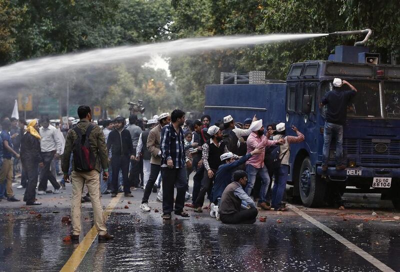 Police use a water cannon to disperse supporters of the Aam Aadmi Party outside the headquarters of India's main opposition Bharatiya Janata Party (BJP) in New Delhi. Adnan Abidi / Reuters