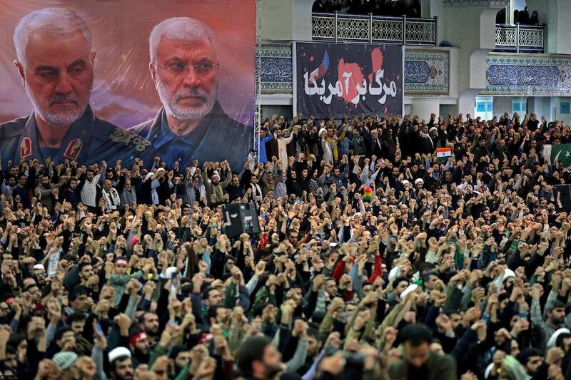 A poster shows late Iranian military commander Qassem Soleimani and late Iraqi militia commander Abu Mahdi al-Muhandis, as Iranian worshippers chant slogans during the Friday prayers sermon led by Iran's Supreme Leader Ayatollah Ali Khamenei, in Tehran, Iran January 17, 2020. Official Khamenei website/Handout via REUTERS ATTENTION EDITORS - THIS IMAGE WAS PROVIDED BY A THIRD PARTY. NO RESALES. NO ARCHIVES     TPX IMAGES OF THE DAY