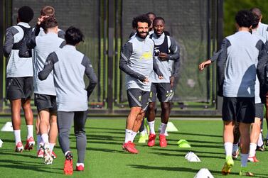 Liverpool's Egyptian midfielder Mohamed Salah takes part in a training session at the Axa training centre in Kirkby, north of Liverpool in north-west England on the eve of their UEFA Champions League, Group B football match against Porto on September 27, 2021.  (Photo by Paul ELLIS  /  AFP)