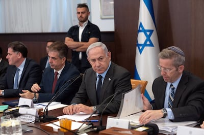 Israeli Prime Minister Benjamin Netanyahu sits beside Foreign Minister Eli Cohen, second from left, at a Cabinet meeting. EPA