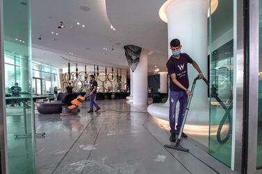 Staff carry out a thorough cleaning operation at the W Hotel on Yas Island. Victor Besa/The National