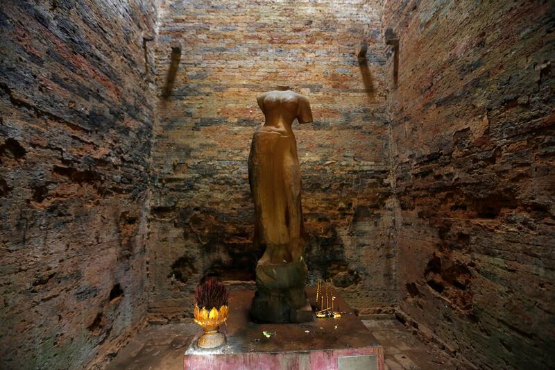 A religious figure is seen inside Sambor Prei Kuk, or 'the temple in the richness of the forest' an archaeological site of ancient Ishanapura, a UNESCO world heritage site, in Kampong Thom province, Cambodia. Samrang Pring / Reuters