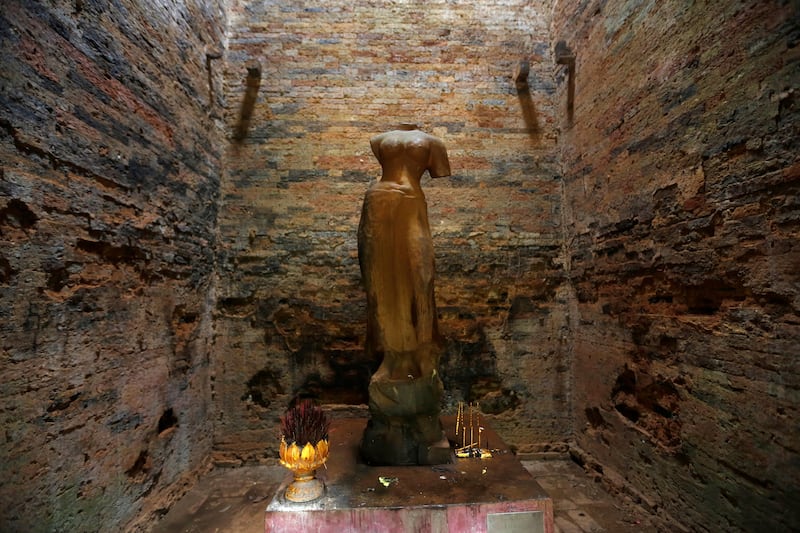A religious figure is seen inside Sambor Prei Kuk, or 'the temple in the richness of the forest' an archaeological site of ancient Ishanapura, a UNESCO world heritage site, in Kampong Thom province, Cambodia. Samrang Pring / Reuters