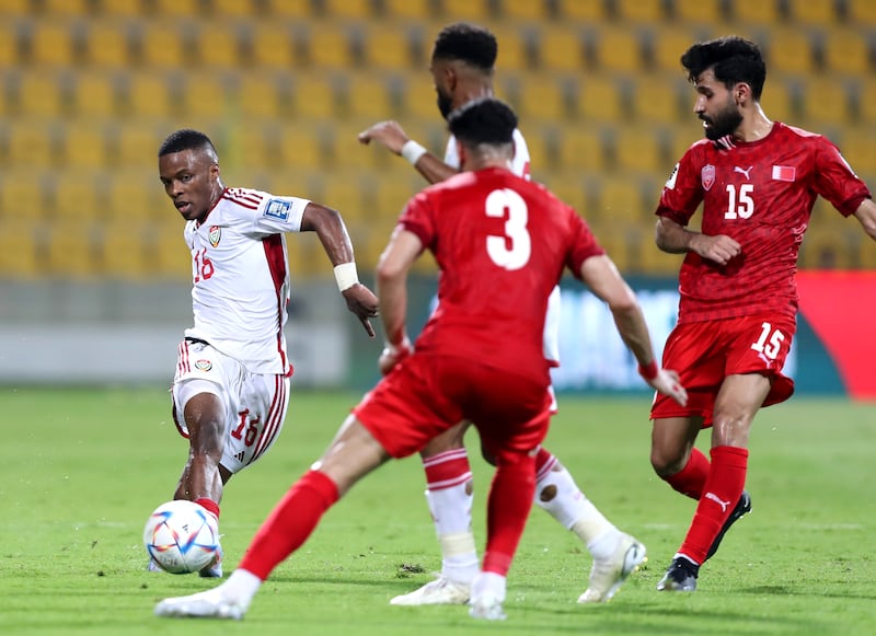 UAE's Mubarak Zamah attempts to pass the ball past Bahrain players during the match in Dubai.