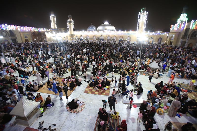 Iraqi Sunni Muslims gather for the Laylat Al Qadr – Night of Power – in the shrine of cleric Sheikh Abdel Kader Al Gilani, in central Baghdad. EPA