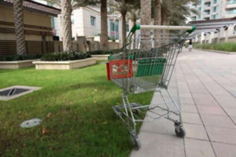 A trolley sits abandned on the grounds of Dubai Marina. The community's developer, Emaar, has imposed fines on those who disrupt the serenity and order of its properties.