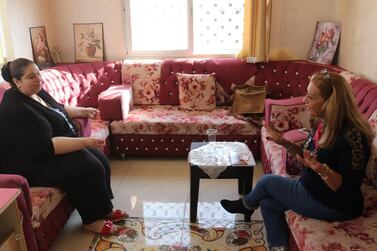 Asma Hijazin (left) discusses women's political prospects with Jordanian candidate for parliament Wafa Yousif Tarawneh. The National