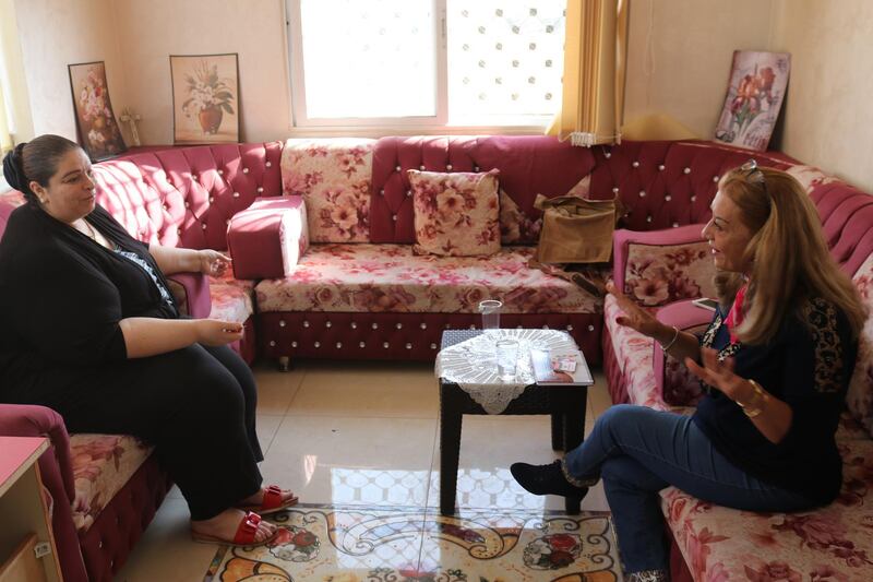 Asma Hijazin (left) discusses womenâ€™s political prospects with candidate for parliament Wafa Yousif Tarawneh (right) at her makeshift office in Karak, southern Jordan on October 31, 2020. 
Taylor Luck for The National