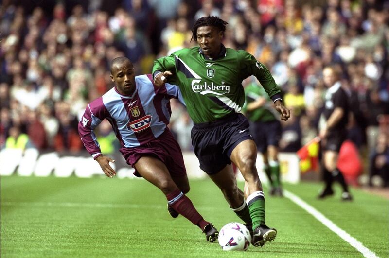 2 Oct 1999:  Rigobert Song of Liverpool is chased by Julian Joachim of Aston Villa during the FA Carling Premiership match played at Villa Park in Birmingham, England. The game ended in 0-0 draw. \ Mandatory Credit: Ross Kinnaird /Allsport