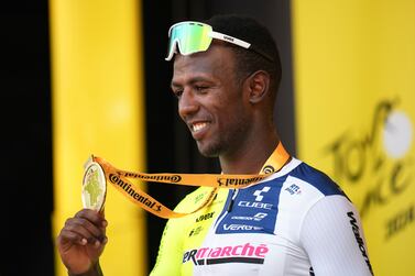 Stage winner Eritrea's Biniam Girmay celebrates on the podium after the third stage of the Tour de France cycling race over 230. 8 kilometers (143. 4 miles) with start in Piacenza and finish in Turin, Italy, Monday, July 1, 2024.  (AP Photo / Daniel Cole)