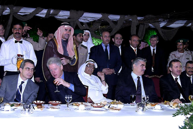 From L to R: Former president of Mexico Ernesto Zedillo, Former US president Bill Clinton, Saudi Businessman Saleh Kamel, Turkish Prime Minister Recep Tayyib Erdogan and Lebanese Prime Minister Rafiq Hariri attend a dinner on the sidelines of the second day of the Jeddah Economic Forum 18 January 2004 in the Red Sea city of Jeddah. So long marginalized in Saudi Arabia, women dominated 17 January the opening of the influential Jeddah Economic Forum, which heard a ringing call for change from Lubna al-Olayan, the first female to deliver the keynote speech. AFP PHOTO/Mahmoud Mahmoud (Photo by MAHMOUD MAHMOUD / AFP)
