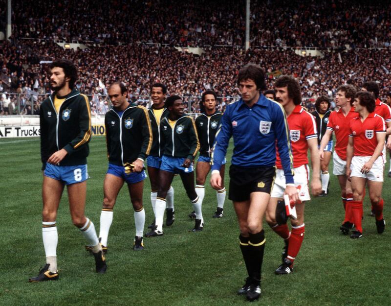 File photo dated 12-05-1981. England's Ray Clemence, right, and Brazil's Socrates lead their respective teams out before the international friendly at Wembley Stadium. Former Liverpool, Tottenham and England goalkeeper Clemence died on Sunday at the age of 72. PA Wire.