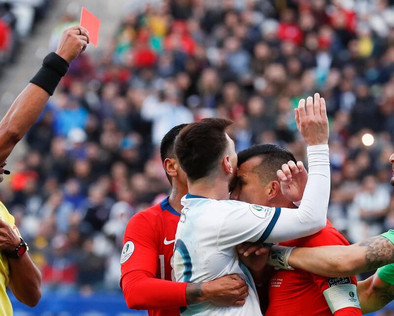 Messi and Chile's Medel clash. AP Photo