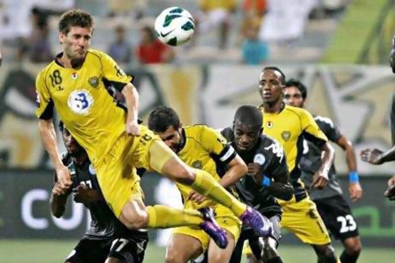 Al Wasl's Emiliano Alfaro heads the ball during the Etisalat Cup match against Al Dhafra. Jeff Topping / The National