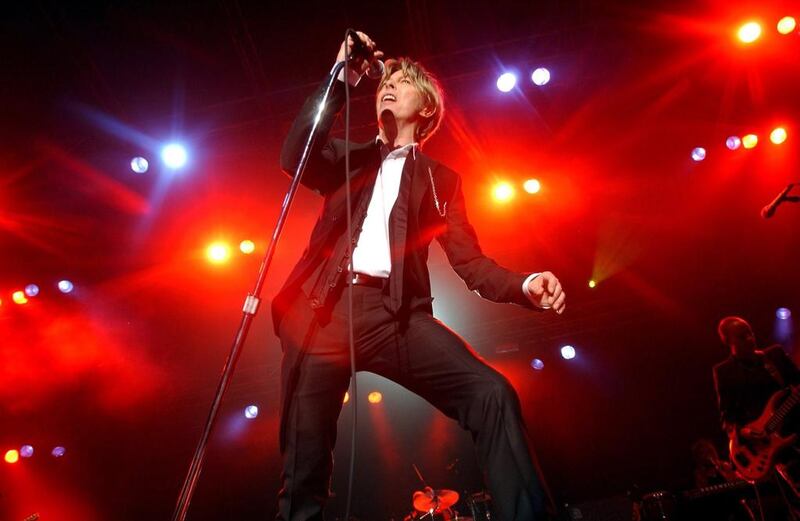 David Bowie performing on stage during a concert in Kristiansand, Norway on July 3, 2002. EPA/HEIKO JUNGE