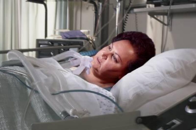 heavy woman in hospital bed staring