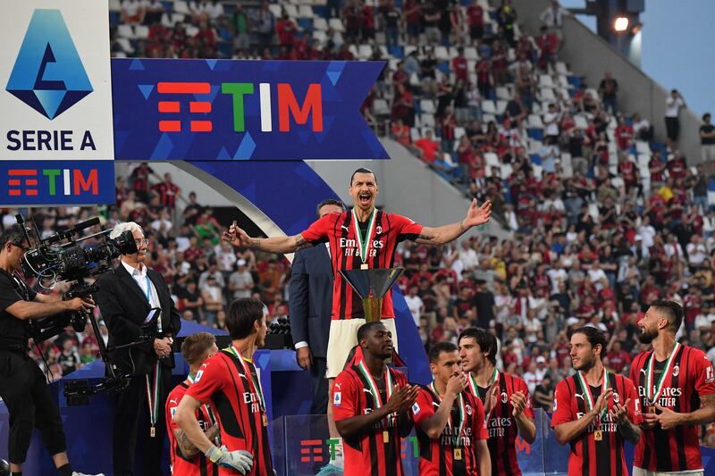 Zlatan Ibrahimovic and his AC Milan teammates celebrate winning the Serie A title. AFP